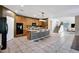Spacious kitchen featuring a large center island, wooden cabinetry, and modern appliances at 5726 W Park View Ln, Glendale, AZ 85310
