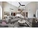 Staged living room with high ceilings, wood floors, comfortable seating, and stylish decor at 5726 W Park View Ln, Glendale, AZ 85310