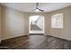 Open living room featuring hardwood floors, arched doorways, and views of the staircase at 5726 W Park View Ln, Glendale, AZ 85310