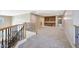 Spacious loft area with carpet flooring, built-in cabinets and view of stairs at 5726 W Park View Ln, Glendale, AZ 85310