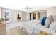 Spacious primary bedroom with a ceiling fan and a door leading to the outside at 5726 W Park View Ln, Glendale, AZ 85310