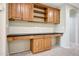 Office area featuring built in cabinets and desk area with overhead lighting at 5726 W Park View Ln, Glendale, AZ 85310