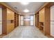Spacious walk-in closet with built-in shelving and drawers at 5726 W Park View Ln, Glendale, AZ 85310