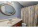 Bathroom features a vanity, a mirror, and a shower with a curtain at 601 E Palo Verde Dr # 27, Phoenix, AZ 85012