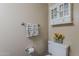 Cozy bathroom with decorative cabinet and shelf providing ample storage at 601 E Palo Verde Dr # 27, Phoenix, AZ 85012
