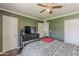 Bedroom features a ceiling fan, neutral walls, and comfortable furnishings at 601 E Palo Verde Dr # 27, Phoenix, AZ 85012
