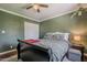 Tranquil bedroom featuring a ceiling fan, natural light, and spacious closet at 601 E Palo Verde Dr # 27, Phoenix, AZ 85012