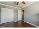 Bedroom showcases neutral walls, a ceiling fan, and hardwood floors at 601 E Palo Verde Dr # 27, Phoenix, AZ 85012