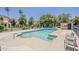 Sparkling community pool with lounge chairs and a secure enclosure for fun and relaxation at 601 E Palo Verde Dr # 27, Phoenix, AZ 85012