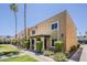 Charming condo exterior with manicured lawn, mature landscaping, and desert plants near the building at 601 E Palo Verde Dr # 27, Phoenix, AZ 85012