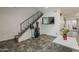 Foyer features stylish flooring, a staircase, musical instruments, and tasteful decor at 601 E Palo Verde Dr # 27, Phoenix, AZ 85012