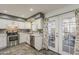 This well-lit kitchen features stainless steel appliances and a door to an enclosed outdoor space at 601 E Palo Verde Dr # 27, Phoenix, AZ 85012