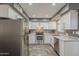 Recently upgraded kitchen with stainless steel appliances, undermount sink, and stylish tile flooring at 601 E Palo Verde Dr # 27, Phoenix, AZ 85012