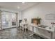 Functional and bright office area with a modern desk, chair, and french doors for easy access to the yard at 601 E Palo Verde Dr # 27, Phoenix, AZ 85012