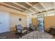 Covered patio with outdoor seating, decorative rug, and a sun decoration at 601 E Palo Verde Dr # 27, Phoenix, AZ 85012