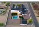 Luxury estate featuring modern architecture, sparkling pool, and landscaped grounds at 6147 E Desert Cove Ave, Scottsdale, AZ 85254