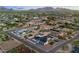 Overhead view of a custom home with desert landscaping and a pool in a sprawling neighborhood at 6147 E Desert Cove Ave, Scottsdale, AZ 85254
