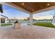 Outdoor kitchen with a built in grill and a beautiful backyard with a pool at 6147 E Desert Cove Ave, Scottsdale, AZ 85254