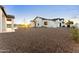 Home features low maintenance landscaping with trees and shrubbery at 6147 E Desert Cove Ave, Scottsdale, AZ 85254