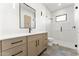 Contemporary bathroom featuring a stand up shower, modern vanity, and sleek black fixtures at 6147 E Desert Cove Ave, Scottsdale, AZ 85254