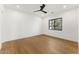 Bright bedroom with hardwood floors and natural light from large windows at 6147 E Desert Cove Ave, Scottsdale, AZ 85254