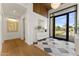 Elegant entryway with tiled flooring, modern decor, and a bright view to the landscaped outdoors at 6147 E Desert Cove Ave, Scottsdale, AZ 85254