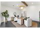 Bright home office featuring a modern desk, stylish chairs, and a large window overlooking the outdoors at 6147 E Desert Cove Ave, Scottsdale, AZ 85254