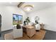 Bright home office featuring a modern desk, stylish chairs, and a large window overlooking the outdoors at 6147 E Desert Cove Ave, Scottsdale, AZ 85254