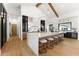 Large kitchen island with marble countertops and seating, complemented by modern appliances and decor at 6147 E Desert Cove Ave, Scottsdale, AZ 85254