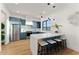 Modern kitchen with blue cabinetry, stainless steel appliances, and a breakfast bar with seating at 6147 E Desert Cove Ave, Scottsdale, AZ 85254