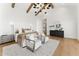 Bright and open bedroom featuring wood floors, a decorative dresser, and large windows for natural light at 6147 E Desert Cove Ave, Scottsdale, AZ 85254