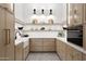 Beautiful pantry features open shelving with stylish light fixtures, great for storage and organization at 6147 E Desert Cove Ave, Scottsdale, AZ 85254