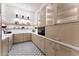 Spacious pantry with ample storage, stainless steel appliances, and custom lighting at 6147 E Desert Cove Ave, Scottsdale, AZ 85254