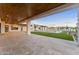 Large covered patio with travertine tile overlooking a backyard pool and spa at 6147 E Desert Cove Ave, Scottsdale, AZ 85254