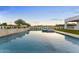 Inviting backyard pool and spa with lush landscaping and sunset views at 6147 E Desert Cove Ave, Scottsdale, AZ 85254