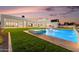 Stunning pool area with a hot tub, water features, and lush green lawn perfect for entertaining at 6147 E Desert Cove Ave, Scottsdale, AZ 85254