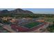 Picturesque aerial view showcasing Arcadia High School nestled against a backdrop of mountains and neighborhood at 6207 E Rose Circle Dr, Scottsdale, AZ 85251