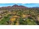 Stunning aerial view of the property and the surrounding golf course community, offering scenic views and recreational opportunities at 6207 E Rose Circle Dr, Scottsdale, AZ 85251