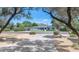 A ranch-style home sits facing the street, framed by trees and a manicured lawn on a sunny day at 6207 E Rose Circle Dr, Scottsdale, AZ 85251