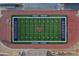 Aerial view of the green football field and track at Arcadia High School at 6207 E Rose Circle Dr, Scottsdale, AZ 85251
