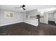 The airy living room features dark floors and flows into the kitchen area with neutral countertops at 6207 E Rose Circle Dr, Scottsdale, AZ 85251