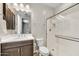 Bathroom with vanity, tile floors and shower stall with sliding glass door at 6503 E Bluefield Ave, Phoenix, AZ 85054