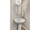 Bathroom featuring a pedestal sink and modern mirror at 6503 E Bluefield Ave, Phoenix, AZ 85054