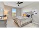 Neutral bedroom with carpet, a ceiling fan, and a queen bed with a gray comforter at 6503 E Bluefield Ave, Phoenix, AZ 85054
