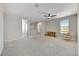 Bright and airy bedroom with a ceiling fan and a cozy rocking chair at 6503 E Bluefield Ave, Phoenix, AZ 85054