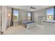 Bright bedroom with a ceiling fan, and a white bed with a blue and white comforter set at 6503 E Bluefield Ave, Phoenix, AZ 85054