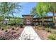 Scenic walkway leading to the community pool area, lined with lush desert vegetation at 6503 E Bluefield Ave, Phoenix, AZ 85054
