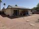 Backyard patio with desert landscaping with mature palms at 6543 E Palm Ln, Scottsdale, AZ 85257