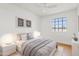 Well-lit bedroom boasts modern decor, a plush rug, and a serene atmosphere at 6863 W Sunnyside Dr, Peoria, AZ 85345
