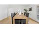 Dining room with seating for six, wood laminate flooring, and modern decor at 6863 W Sunnyside Dr, Peoria, AZ 85345